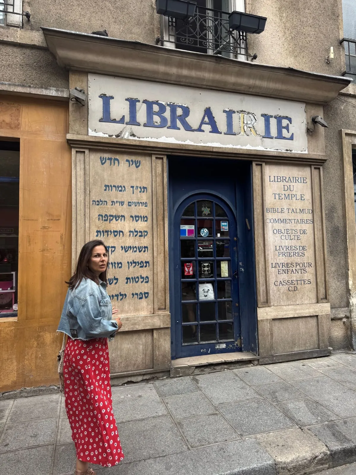 Orlie in front of the old Librairie du Temple Jewish bookshop in the Marais